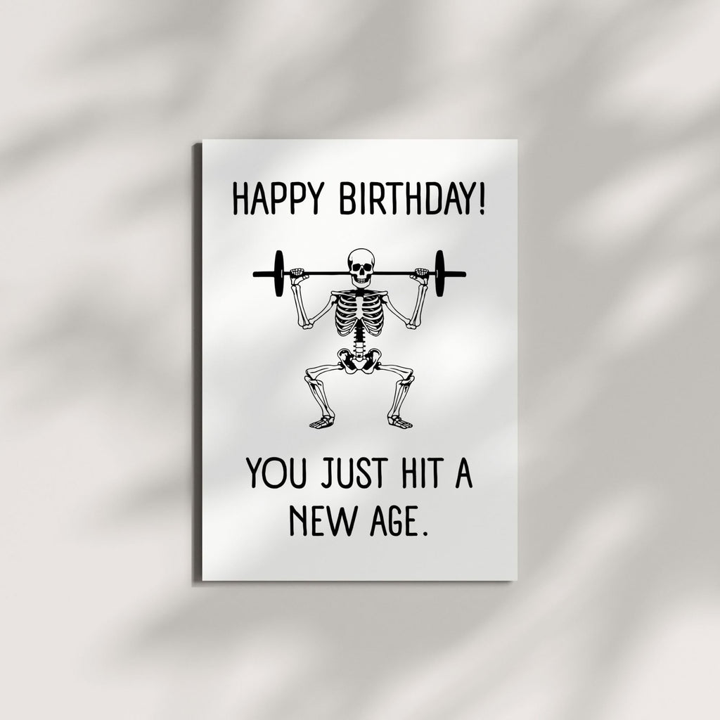Skeleton Birthday Card “You Just Hit a New Age” – Hilarious Greeting Card for Kids, Friends, Men, Women – Universal Birthday Humor – Made in USA
